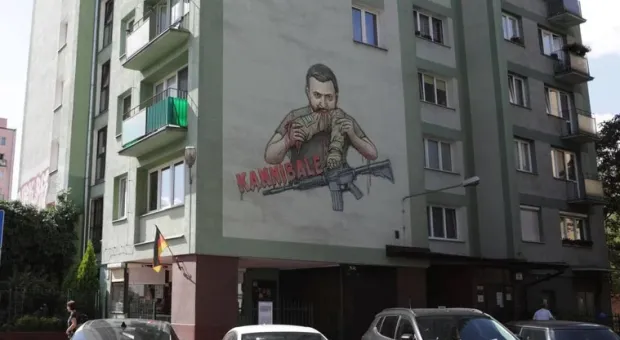 В Берлине ищут автора изображения «Зеленского-каннибала» на стене жилого дома
