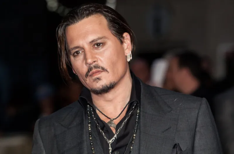 <p>Actor Johnny Depp poses for photographers upon arrival at the Premiere of the film Black Mass, showing as part of the London Film Festival, in central London, Sunday, Oct. 11, 2015. (Photo by Grant Pollard/Invision/AP)</p>
